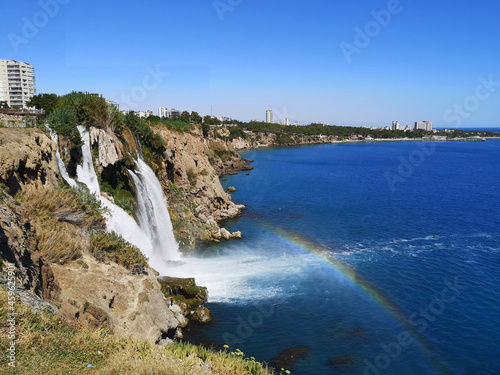 Antalya Duden waterfall. A rainbow appeared in front of the waterfall pouring into the sea