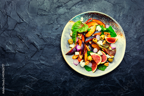 Fresh salad with plums and figs,space for text