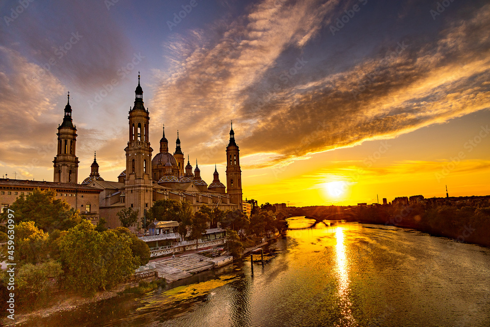 picturesque sunset on a summer day in the city of Zaragoza in Spain overlooking the river and the cathedral