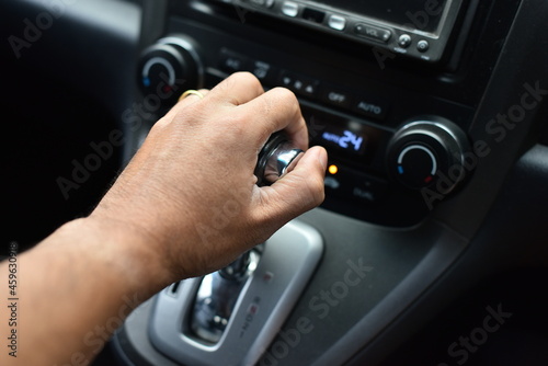 Man's hand holding an automatic gear in a car © rnophoto