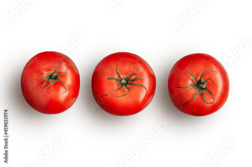 Three ripe red tomatoes in a row isolated on white background. Raw vegetables. Flat lay view. close up