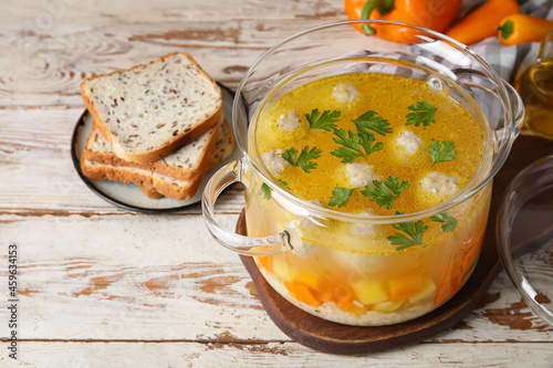 Pot with tasty meatball sou...