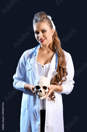 Sexy young woman dressed as...