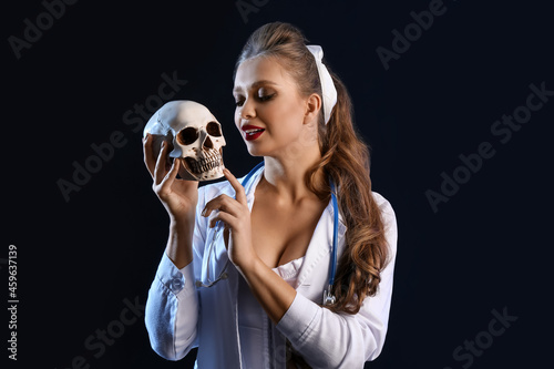 Sexy young woman dressed as...