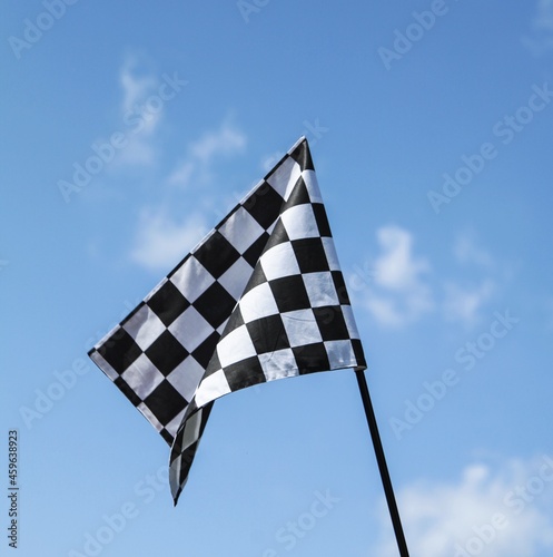 Racing Flag On Sky Background