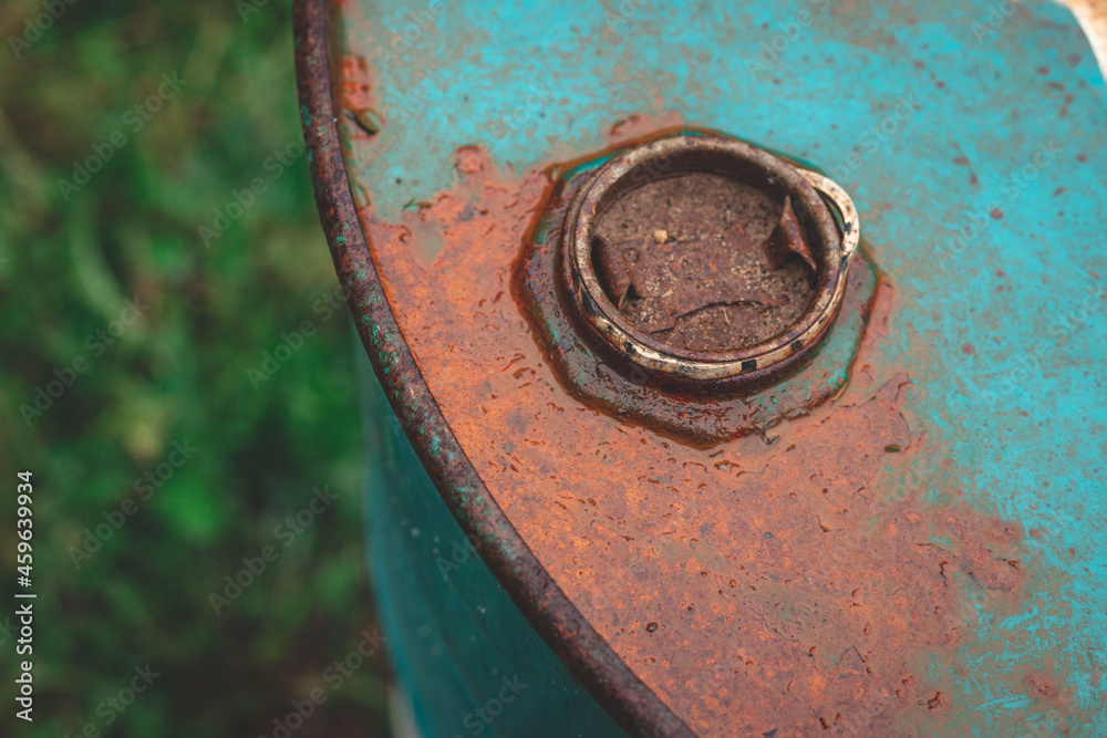 one closed old rusty metal brown barrel on the street one closed old rusty metal brown barrel on the street