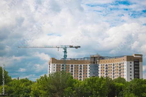 The architectural complex of residential buildings on sky background