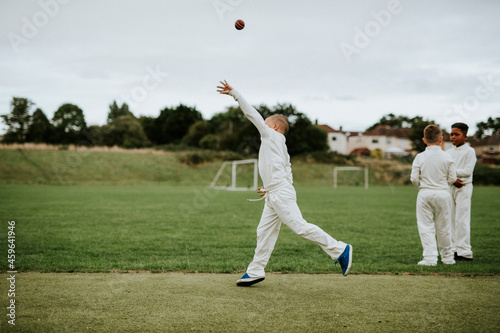 Cricket player catching a ball