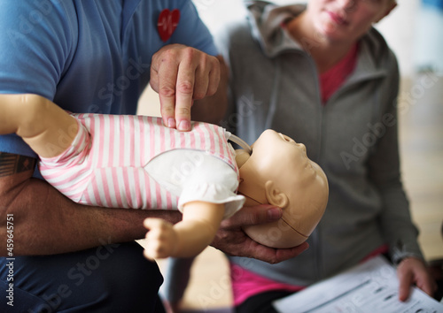 Obraz na płótnie CPR first aid training on a doll infant