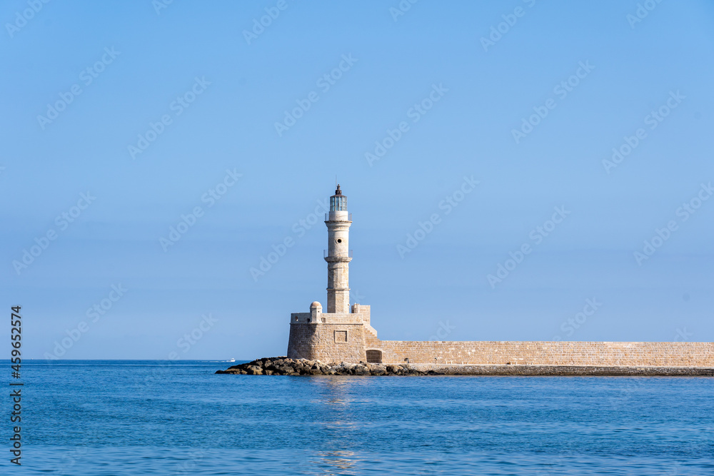 Chania, Greece - September 22, 2021: The historical lighthouse in the old harbour.