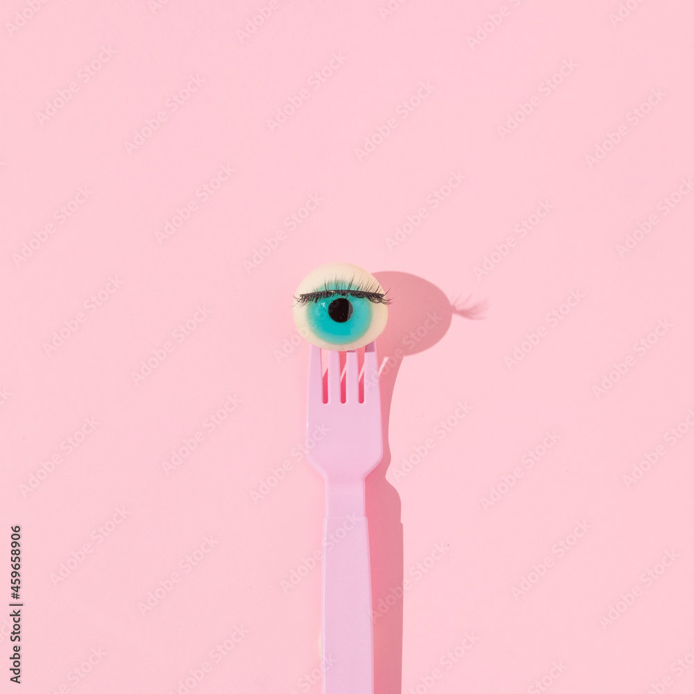 Creative layout with eyeball figurine on pink fork on pastel pink background.  Halloween aesthetic food concept. Minimal surreal idea. Stock Photo | Adobe  Stock
