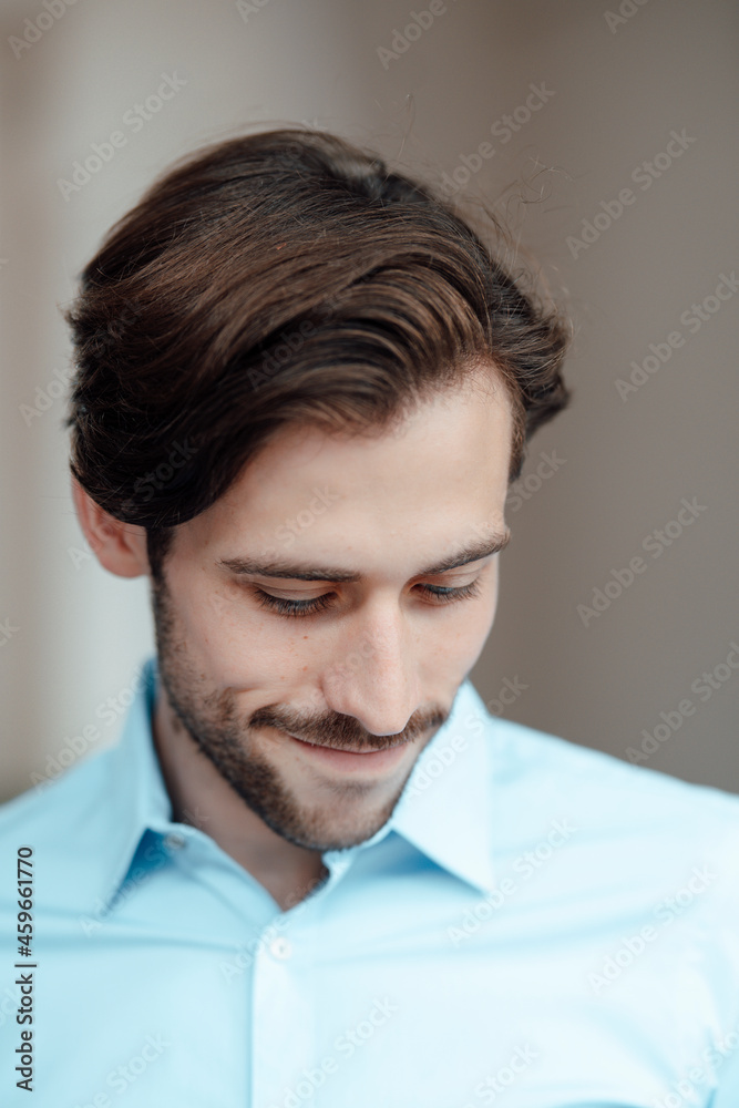 Smiling businessman with brown hair and stubble Smiling businessman with brown hair and stubble