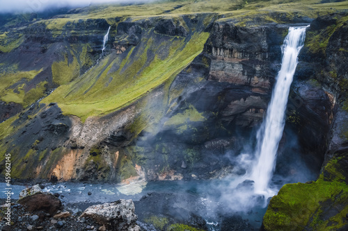 Dramatic landscape of epic Haifoss Waterfall in Landmannalaugar canyon, Iceland