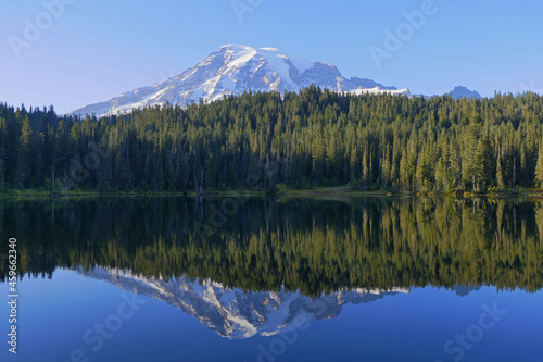Mount Rainier mirroring in lake, National Park, popular touristic and hiking destination in Washington, United States