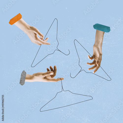 Contemporary art collage of human hands holding clothes hangers isolated over blue background. Concept of sales photo