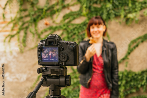 Woman recording video at park