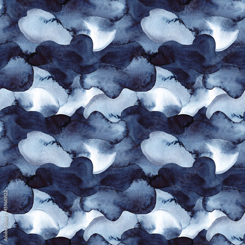 Decorative Christmas seamless pattern of abstract watercolor spots in blue and dark blue indigo colour. Winter hand painted texture.