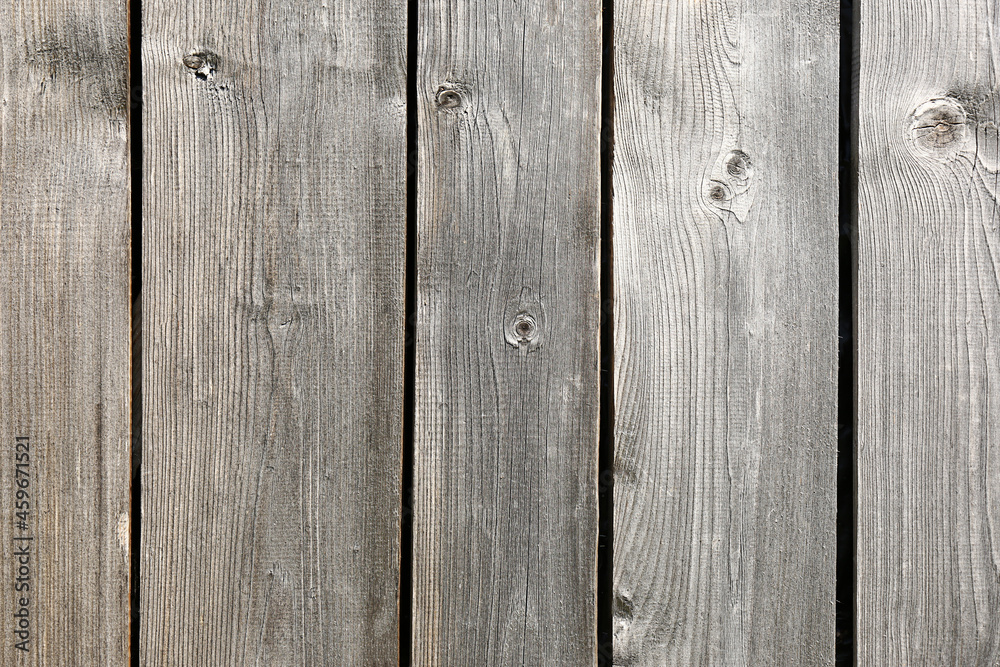 Naklejka premium Row of wooden planks as background, fence texture