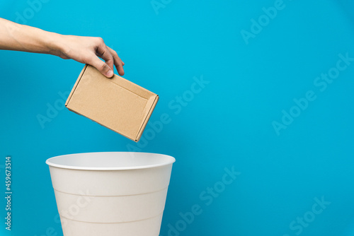 The cardboard boxes are thrown into the trash for disposal