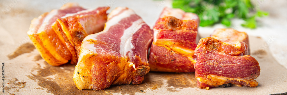 raw ribs pork meat pickled spices and herbs fresh portion ready to eat meal snack on the table copy space food background rustic. top view keto or paleo diet raw ribs pork meat pickled spices and herbs fresh portion ready to eat meal snack on the table copy space food background rustic. top view keto or paleo diet