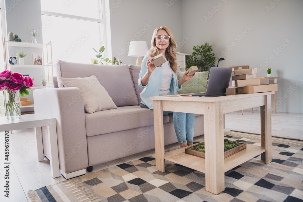 Full length body size photo woman wearing glasses keeping carton box unpacking Full length body size photo woman wearing glasses keeping carton box unpacking