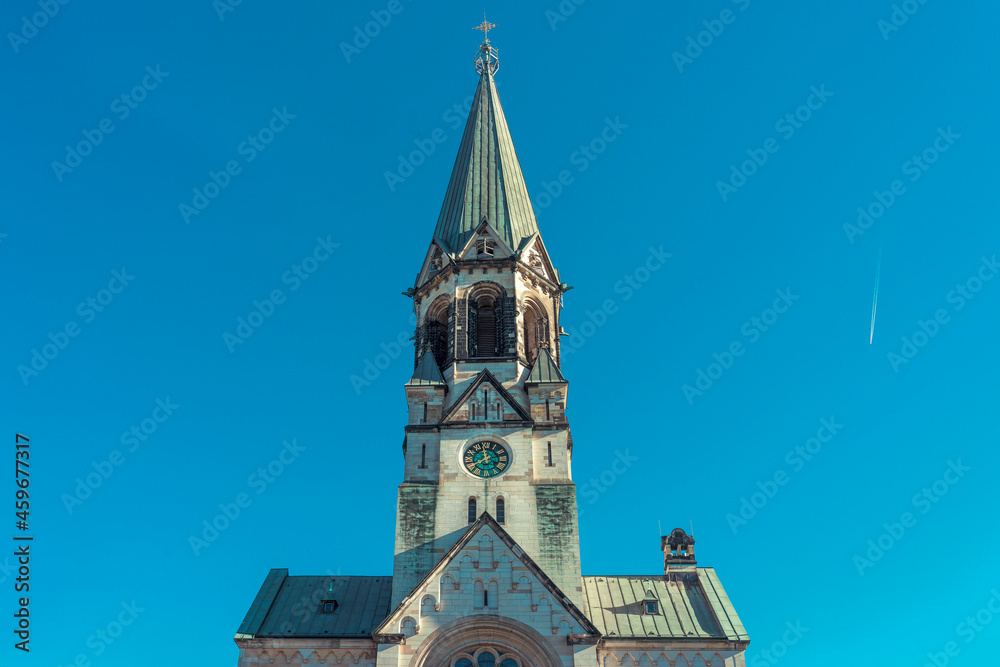 church tower with a clock against a clear blue sky