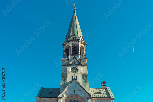 church tower with a clock against a clear blue sky