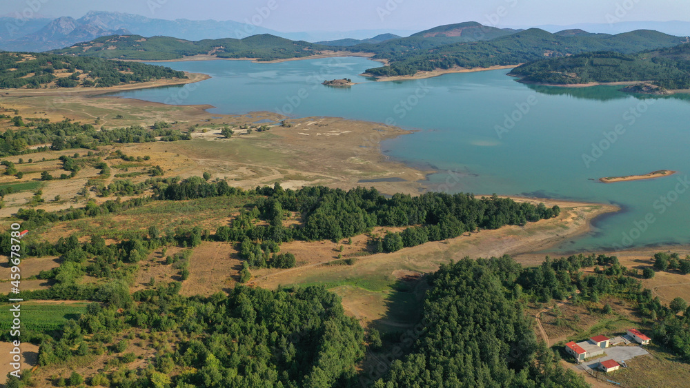 Aerial drone top down photo of beautiful artificial lake of Plastiras or Tavropos with wonderful nature and famous outdoor and water activities like canoe and water bike, Thessaly, Greece 