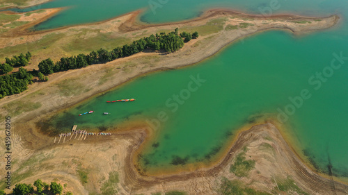 Aerial drone top down photo of beautiful artificial lake of Plastiras or Tavropos with wonderful nature and famous outdoor and water activities like canoe and water bike, Thessaly, Greece 