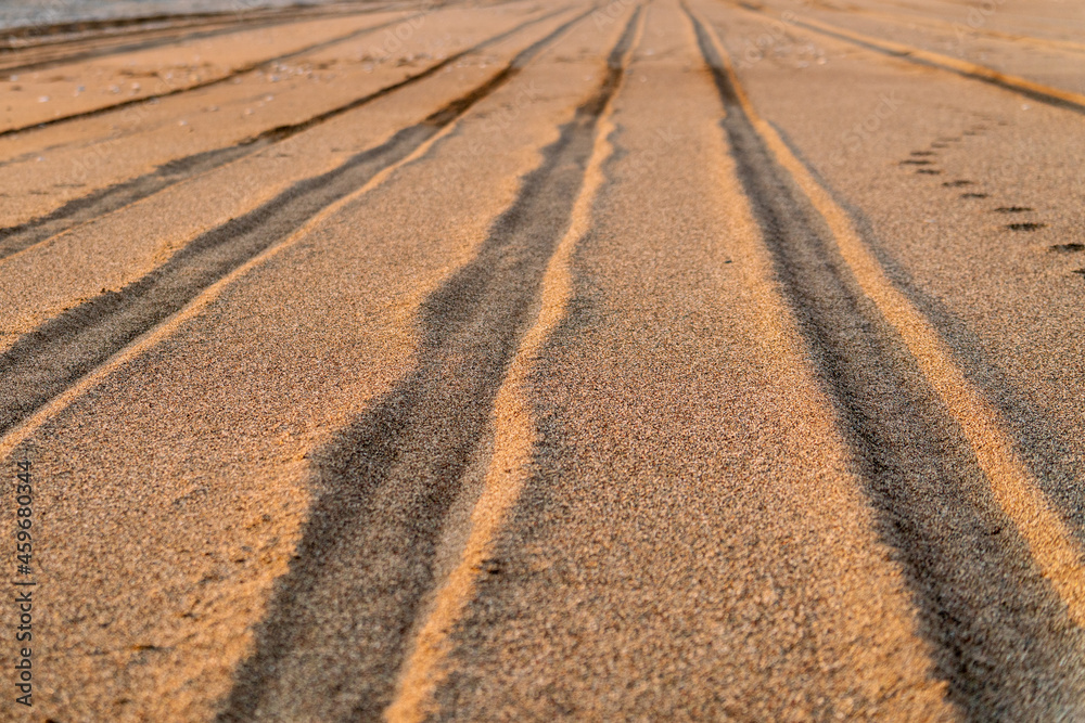 Texture of even rows of wheel tracks in the sand. Texture of even rows of wheel tracks in the sand.