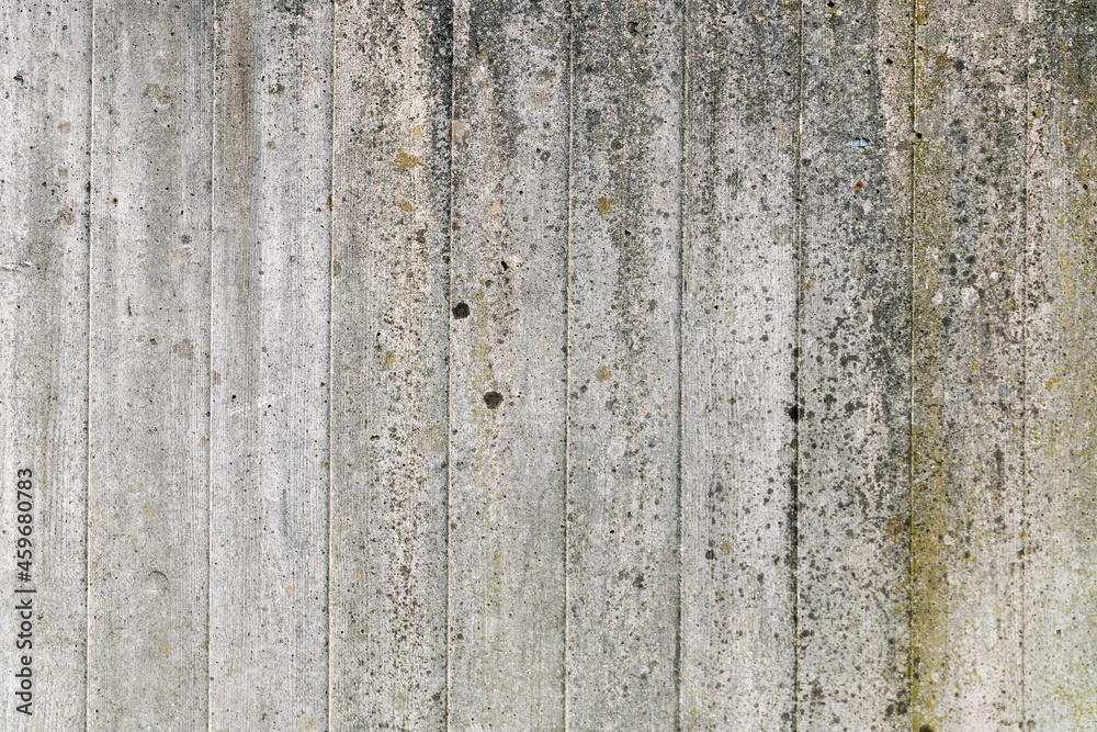 Fototapeta premium Texture of gray concrete wall with traces of wooden formwork.