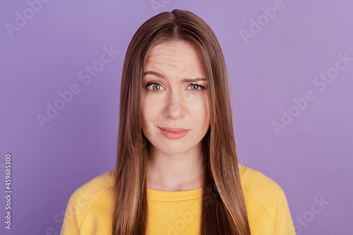 Portrait of doubtful clueless confused lady raise eyebrow puzzled face on violet background photo