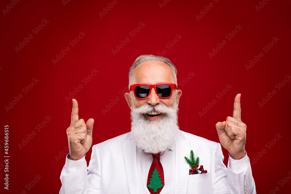 Photo of retired happy old man point finger empty space up wear tree tie isolated on red color background Photo of retired happy old man point finger empty space up wear tree tie isolated on red color background