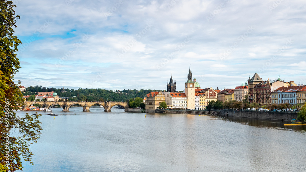 Prague, Czech Republic. A view over the Vlatava River with the Charles Bridge and Old Town Bridge Tower in the distance.