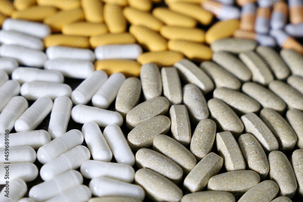 Pills and capsules, variety of medications. Background for pharmacy, antibiotics, vitamins Pills and capsules, variety of medications. Background for pharmacy, antibiotics, vitamins