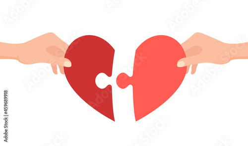 Hands connecting jigsaw puzzle in heart form. Love concept