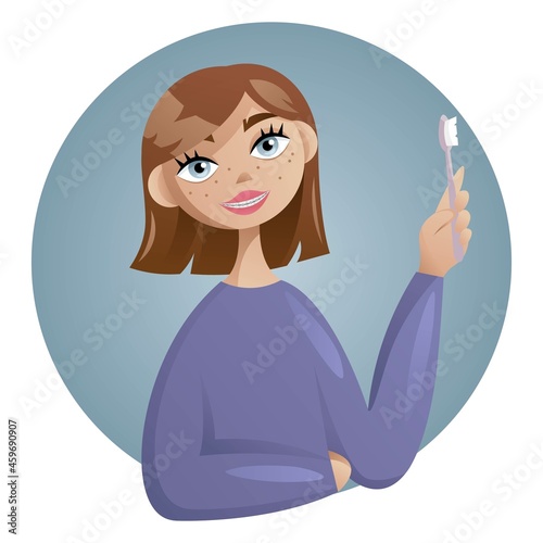 Teenage girl in braces smiles and holds a toothbrush in her hand. Brown-haired girl with freckles and squares. Care of teeth and braces system. 