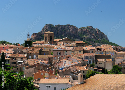 The Old Town Of Roquebrune D'Argens In Front Of A Giant Rock In France On A Beautiful Summer Day With A Clear Blue Sky photo