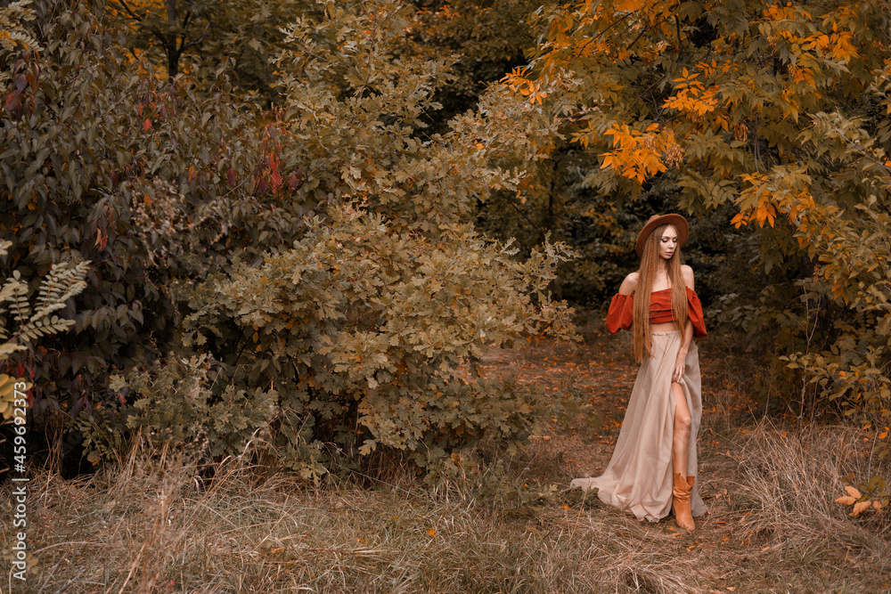 model in autumn clothes in the autumn park. free space for text model in autumn clothes in the autumn park. free space for text