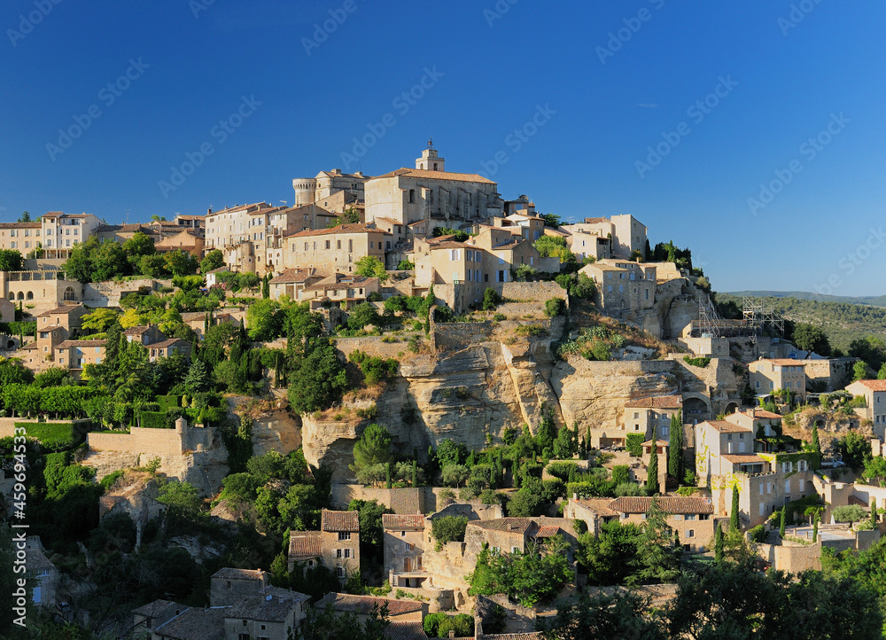 Historic Mountain Village Gordes In Provence France On A Beautiful Summer Day With A Clear Blue Sky
