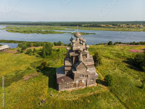 Wooden church in honor of the icon of Our Lady of Vladimir. Russia, Arkhangelsk region, village Zherebtsova Gora  photo