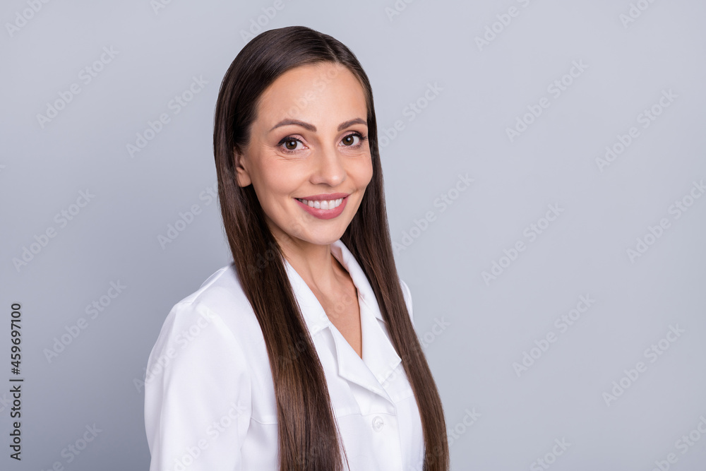 Photo of mature attractive woman happy positive smile nurse practitioner medical hospital isolated over grey color background Photo of mature attractive woman happy positive smile nurse practitioner medical hospital isolated over grey color background