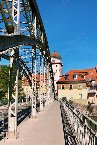 Puente de hierro con torre al fondo. Leoben, Austria photo