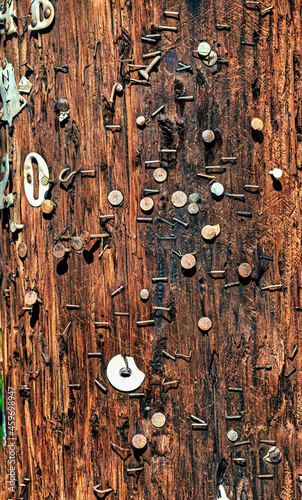 Many a poster or advertisement has hung on this telephone pole now covered in staples and push pins.  Pole in Windsor NY. photo