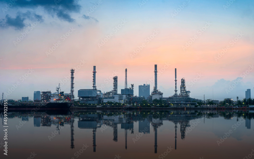 oil refinery at sunset