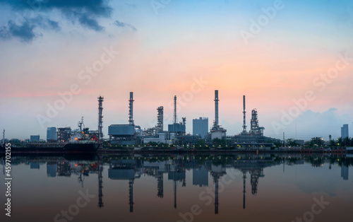 oil refinery at sunset