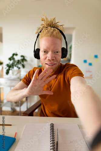 Albino african american man working from home making video call