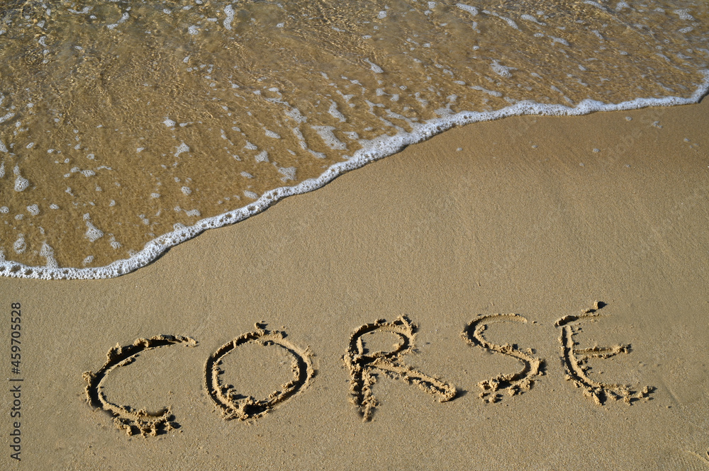 Fototapeta premium Corse écrit dans le sable d'une plage
