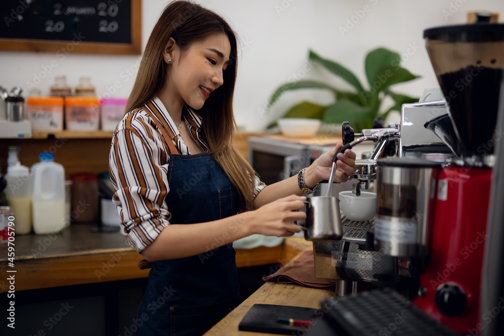 Portrait of Startup successful small business owner in coffee shop.woman barista cafe owner. SME entrepreneur seller business concept	