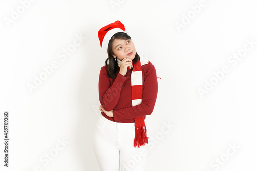 Thinking Gesture of Beautiful Asian Woman Wearing Red Turtleneck and Santa Hat Isolated On White Background